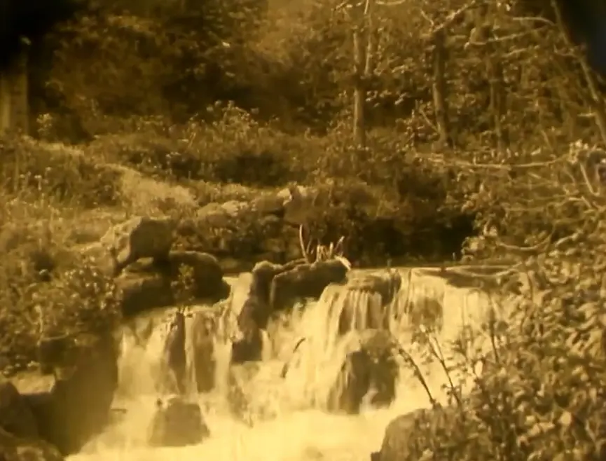 Nude Woman by Waterfall scene
